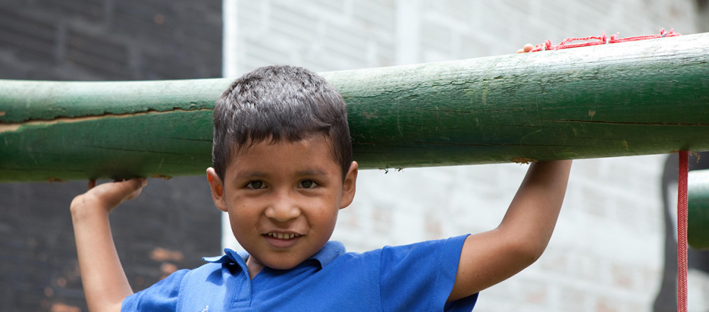 Emiliani Project Child Holding Large Bamboo